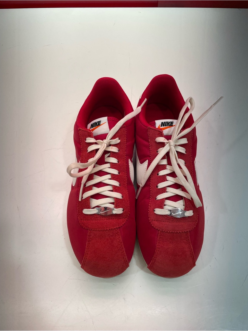 Nike Women’s Red Sneakers with White Swoosh and Laces